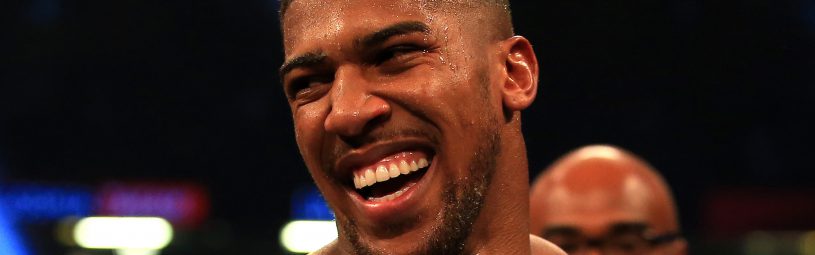 Anthony Joshua celebrates victory over Carlos Takam during the IBF World Heavyweight Title, IBO World Heavyweight Title and WBA Super World Heavyweight Title bout at the Principality Stadium, Cardiff.