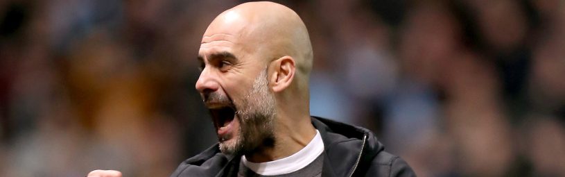 Manchester City manager Pep Guardiola celebrates as Leroy Sane scores the first goal of the game