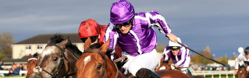 Saxon Warrior (right) ridden by Ryan Moore wins the Racing Post Trophy Stakes during Racing Post Trophy day at Doncaster Racecourse.